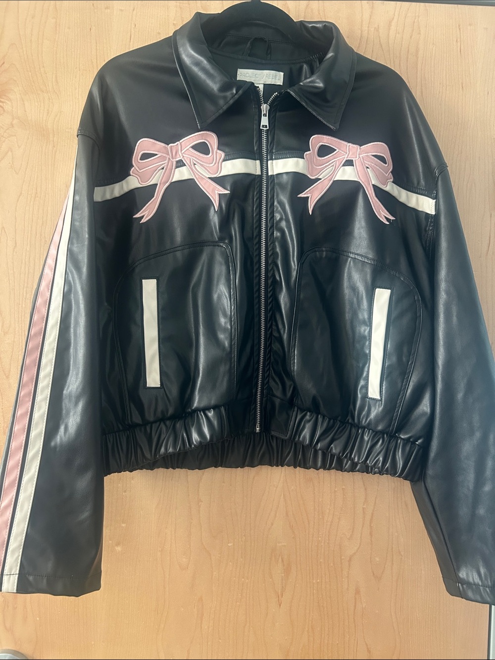 Black Faux Leather Jacket with Pink Bow Accents